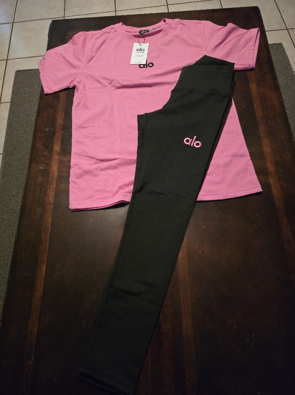 ALO Yoga Pink Tee with Black Leggings